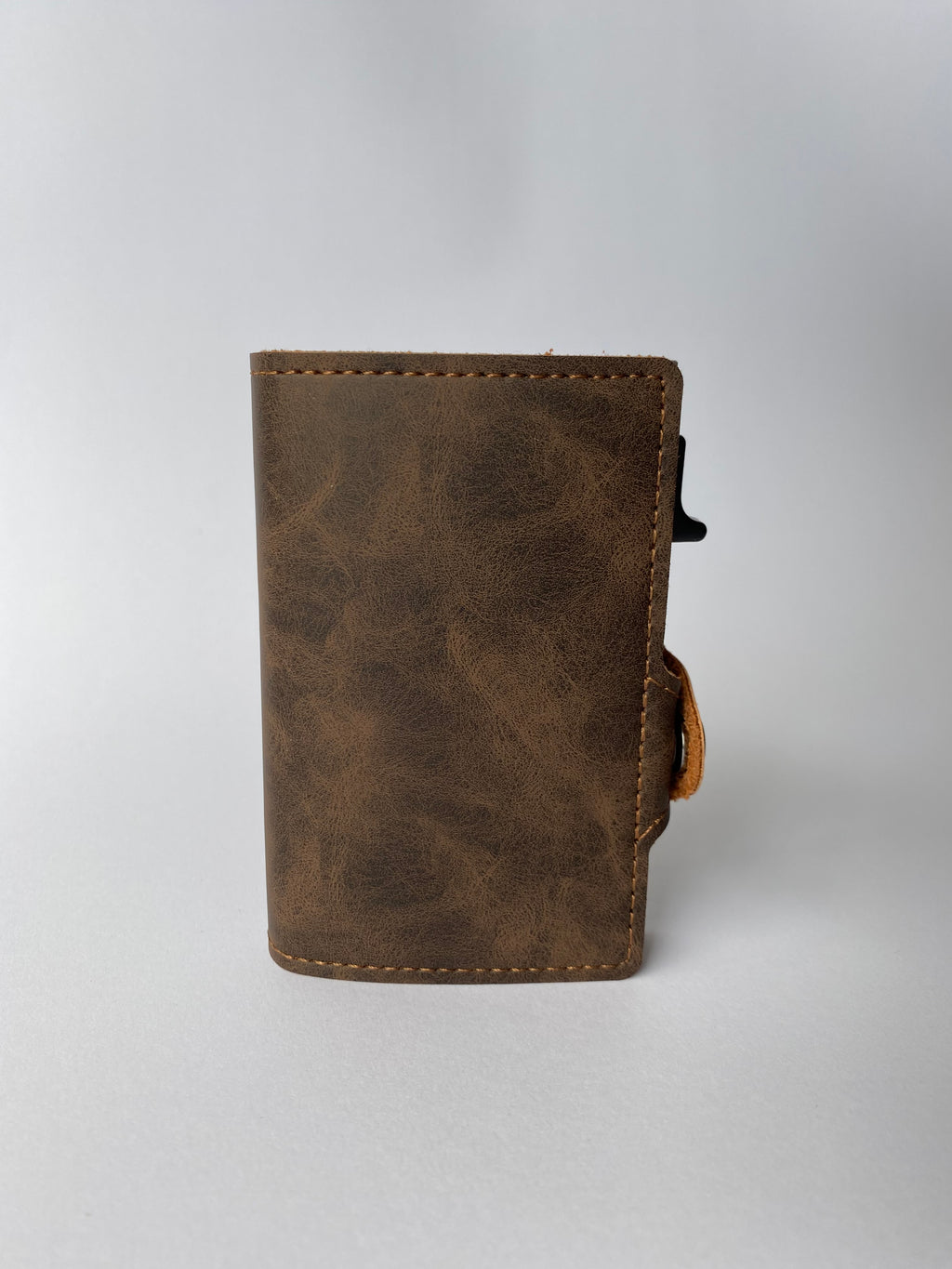 Minimalist RFID wallet with pop up mechanism and space for cash and cards
