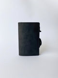 Minimalist RFID wallet with pop up mechanism and space for cash and cards